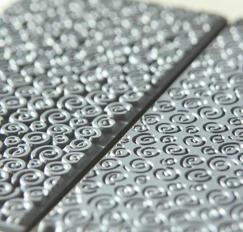 Texture Tile - Spirals Mini (TTL-120) on the left, next to Texture Tile - Spirals Mini Embossed (TTL-121) on the right