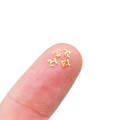 Tiny brass elven letters.