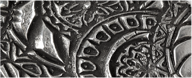 Texture in fired silver clay.