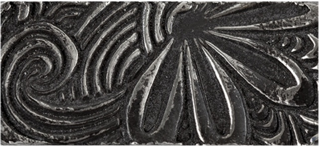 Texture in fired silver clay.
