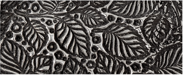 Texture in fired silver clay.